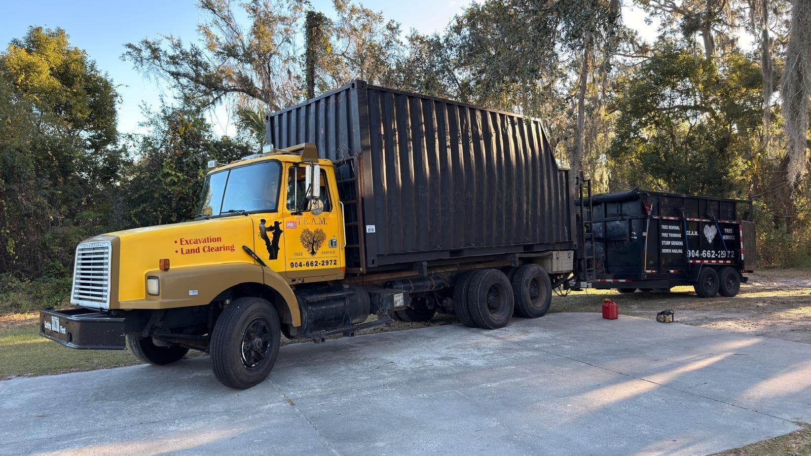 T.E.A.M. Tree Service debris hauler truck for excavation and land clearing